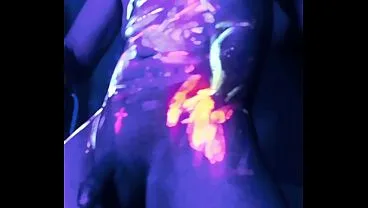 Erotic Man in Neon UV Light